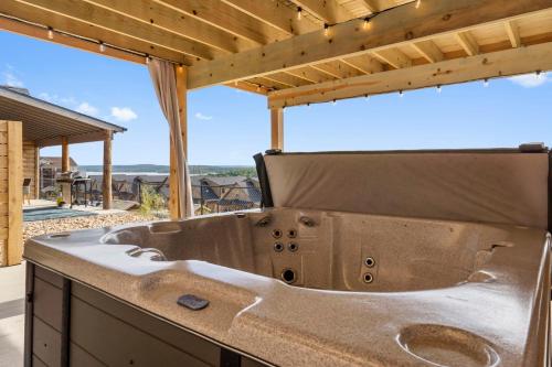 a kitchen with a large sink and a view of the ocean at Private Hot Tub-Free Attraction Tickets-Lake Lookout-Community Indoor & Outdoor Pools in Branson
