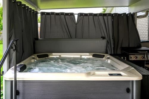 a hot tub in the back of a tent at bp1 Sunny Sunny in Beavercreek
