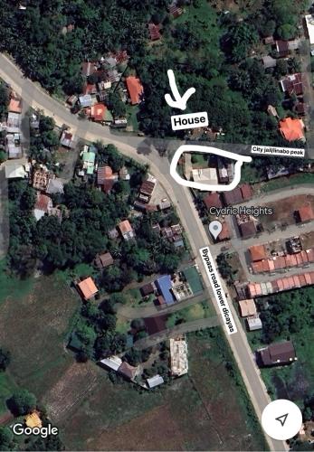 an overhead view of a street with houses and trees at TenEighteen Family Vacation Home in Dipolog