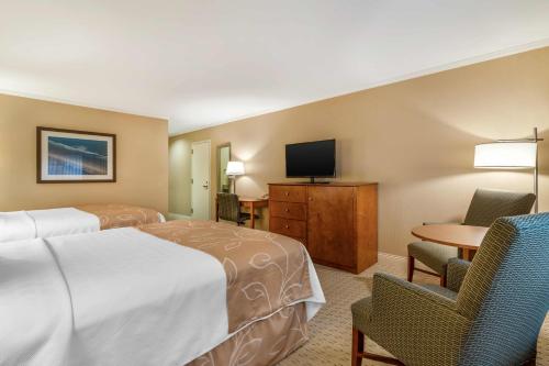 Ένα ή περισσότερα κρεβάτια σε δωμάτιο στο Gorges Grant Hotel