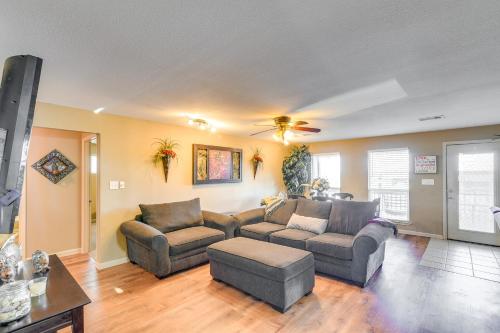 a living room with two couches and a ceiling fan at Near Ocean Home with Deck and Grill in Surfside Beach in Surfside Beach