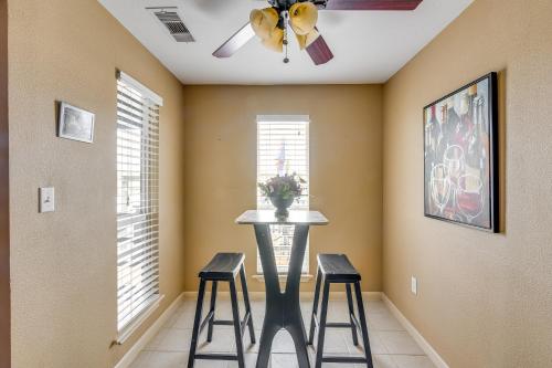 a dining room with a table and two stools at Near Ocean Home with Deck and Grill in Surfside Beach in Surfside Beach