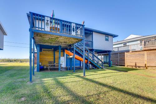 a house with a playground with a slide at Near Ocean Home with Deck and Grill in Surfside Beach in Surfside Beach