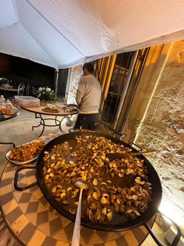 a large pile of food on top of a table at Demeure Sainte Clotilde, événementiel et chambres d'hôtes à Neffies in Néffiès