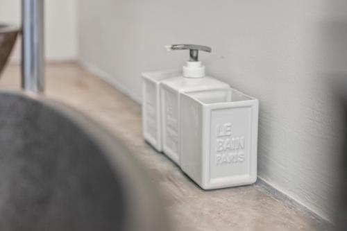 a bathroom sink with a faucet on a wall at PM78 Boutique Apartments in Willemstad