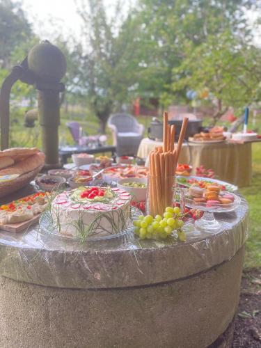 a table of food with cakes and other foods on it at Wohnpension Litzkendorf in Naumburg