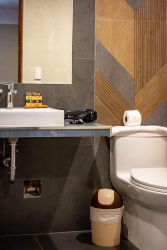 a bathroom with a sink and a toilet at Santuario Machupicchu in Machu Picchu