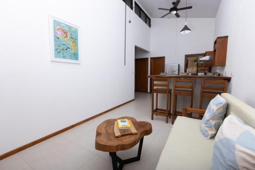a living room with a couch and a table at Casa Kabuae in Portalón