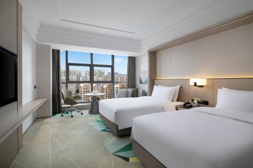 Katil atau katil-katil dalam bilik di Holiday Inn Ningde Dijing by IHG