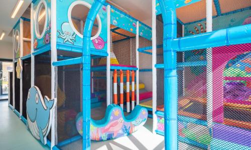 a play room with a slide and a play structure at Aminess Style Camping Avalona Resort - Pitches in Povljana