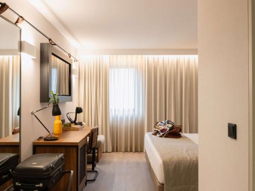 Un ou plusieurs lits dans un hébergement de l'établissement ibis Styles Lisboa Aeroporto
