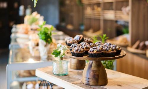 a tray of chocolate cupcakes on a table at Aminess Style Camping Avalona Resort - Pitches in Povljana