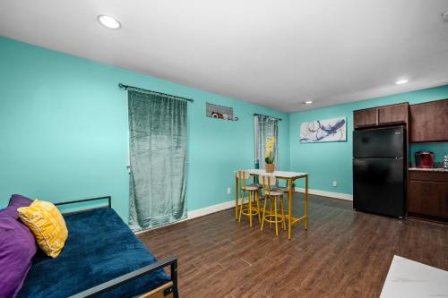 a living room with a couch and a table at 1BR Apt with Fully Equipped Kitchen Close to Major Attractions in Houston