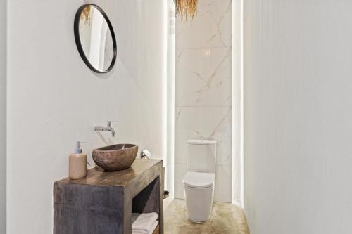 a bathroom with a sink and a toilet at PM78 Boutique Apartments in Willemstad