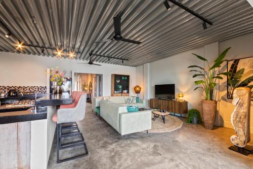 a living room with a couch and a table at PM78 Boutique Apartments in Willemstad