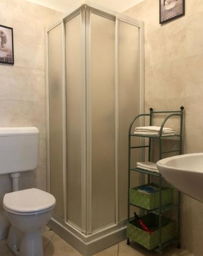 a bathroom with a toilet and a sink at Casa vivace in centro Torino by Turin House Collection in Turin