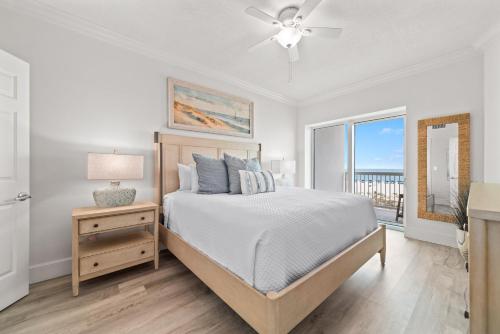 a bedroom with a bed and a view of the ocean at Perdido Dunes Tower Unit 2W in Orange Beach