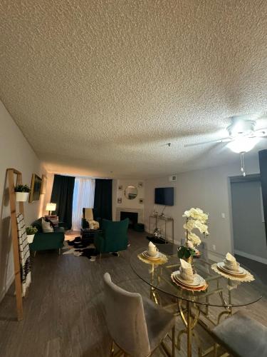 a living room with couches and a table and chairs at Hollywood Apartments Mario & No Themed With Pool FREE parking and WIFI in Los Angeles