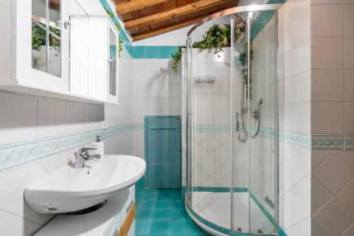 a bathroom with a sink and a shower at [Piazza Santo Spirito] Appartamento con 2 Camere Matrimoniali in Florence
