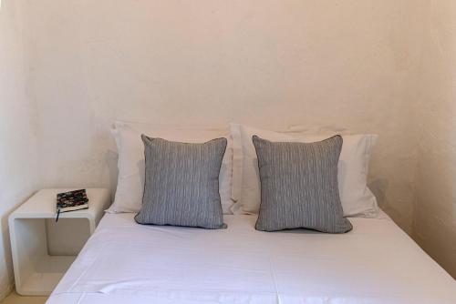 Ένα ή περισσότερα κρεβάτια σε δωμάτιο στο Platanos Cycladic house