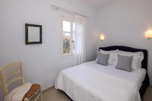 Ένα ή περισσότερα κρεβάτια σε δωμάτιο στο Platanos Cycladic house