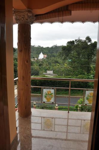 a view from the balcony of a building at Bluemount in Kattappana