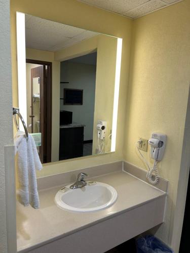 a bathroom with a sink and a mirror at Super 8 by Wyndham Gettysburg in Gettysburg