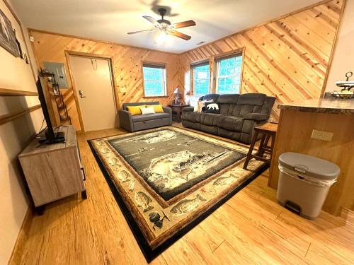 a living room with a couch and a rug at The Barn in Asheville