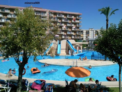 a pool at a resort with people in it at Minerva909 in Benalmádena
