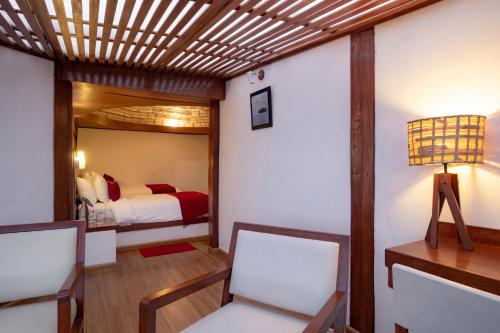 Postel nebo postele na pokoji v ubytování Hotel Palacio de Sal