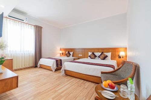 Ένα ή περισσότερα κρεβάτια σε δωμάτιο στο T78 Hotel Managed by Nha khach T78