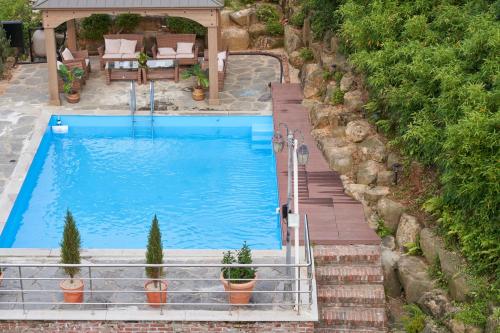 an overhead view of a swimming pool in a backyard at Yeosu View Foret Pension in Yeosu