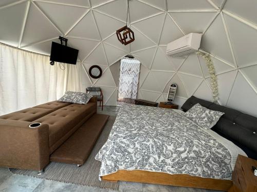 Ένα ή περισσότερα κρεβάτια σε δωμάτιο στο Glamping El Encanto