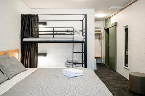 a room with two bunk beds in it at YHA Thredbo in Thredbo