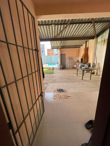 an open door of a house with a patio at Bertioga Rio da Praia in Bertioga