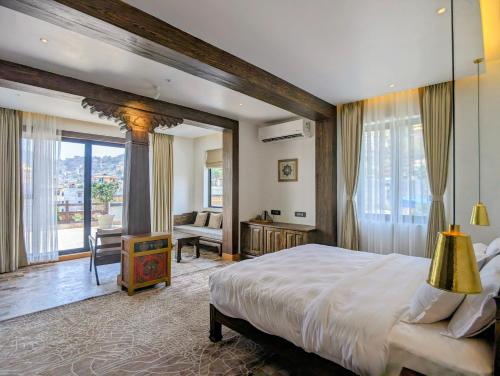 Postel nebo postele na pokoji v ubytování Uma Residence and Suites