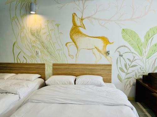 Ein Bett oder Betten in einem Zimmer der Unterkunft 民宿記 台南安平可包棟