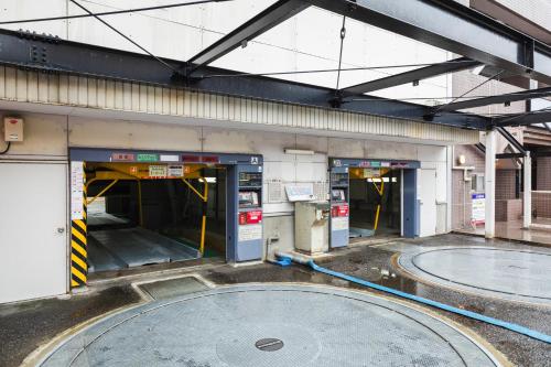 an empty gas station with a gas pump at Hotel Sunroute Niigata in Niigata
