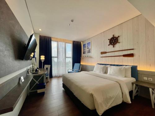 TV a/nebo společenská místnost v ubytování Hemangini Hotel Bandung