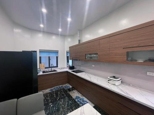 a large kitchen with a sink and a counter at Van villa in Hanoi