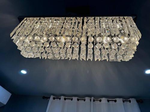 a chandelier filled with lots of money at Island Haven Hideaway 5BR in Nassau