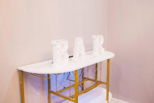 a table with white letters on top of it at Island Haven Hideaway 5BR in Nassau