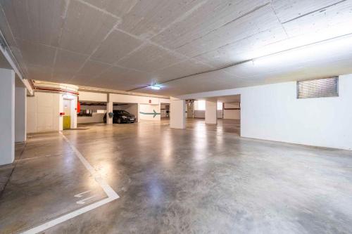 an empty room with a concrete floor in a building at PLAZA INN Blankenburg Ditzingen, Sure Hotel Collection in Ditzingen