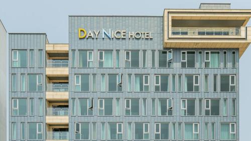 a building with a sign on the side of it at Daynice hotel in Boryeong