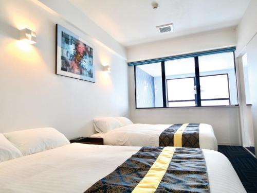 Postel nebo postele na pokoji v ubytování Hotel Chula Vista SENAGA -SEVEN Hotels and Resorts-