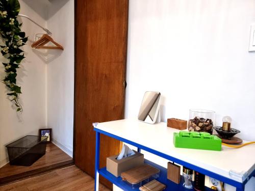 a room with a blue shelf with a phone on it at Y202 & B201 near Hongdae Univ Station in Seoul