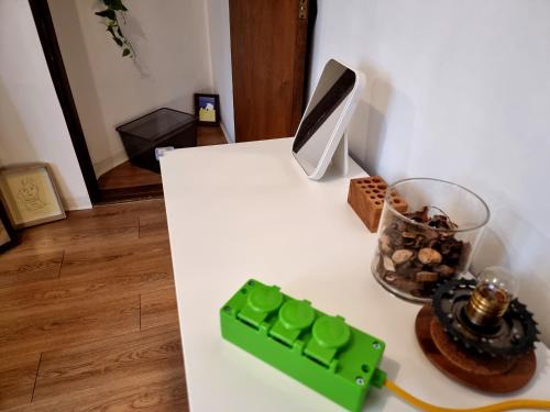 a white table with a green computer keyboard on it at Y202 & B201 near Hongdae Univ Station in Seoul