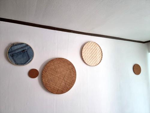 a wall with three cork plates on the wall at Y202 & B201 near Hongdae Univ Station in Seoul