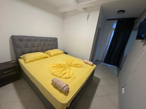 Ένα ή περισσότερα κρεβάτια σε δωμάτιο στο Etna Apartments