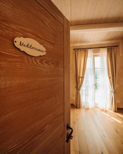 a wooden door in a room with a window at Agriturismo Costa di Faraggiana in Levanto